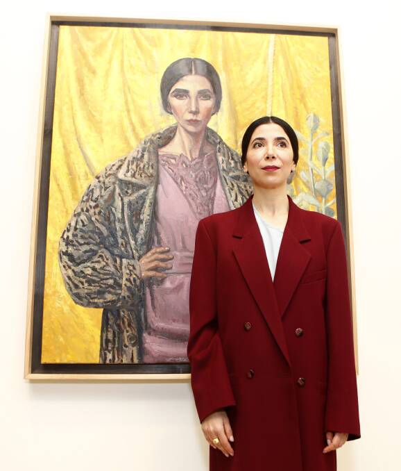 REGIONAL WIN: Yvette Coppersmith with her 2018 Archibald Prize winning self-portrait  which will make its way to Tamworth later this year. Photo: Daniel Munoz