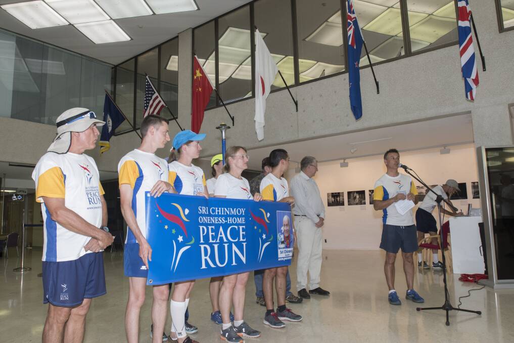 MESSAGE FLAGGED: Runners from around the world stopped in at Tamworth as part of a global torch relay to promote peace. Photo: Peter Hardin 160219PHB027