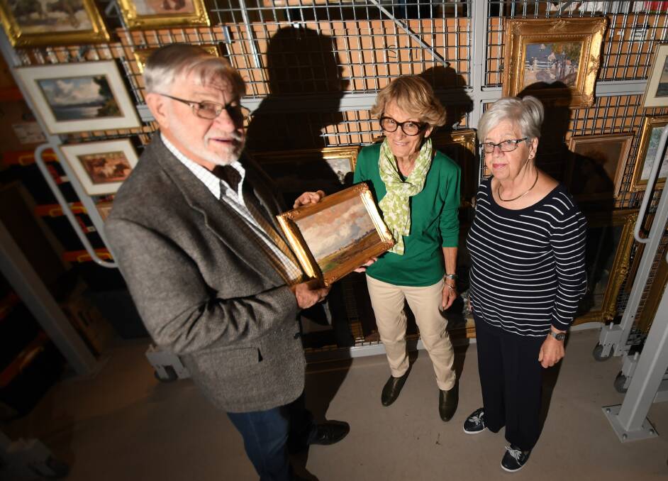 BIRTHDAY BASH: Friends of the gallery Stephen Cunneen, Ruth Blakely and Meg Larkin look over some of the city's prized pieces. Photo: Gareth Gardner 200519GGD01