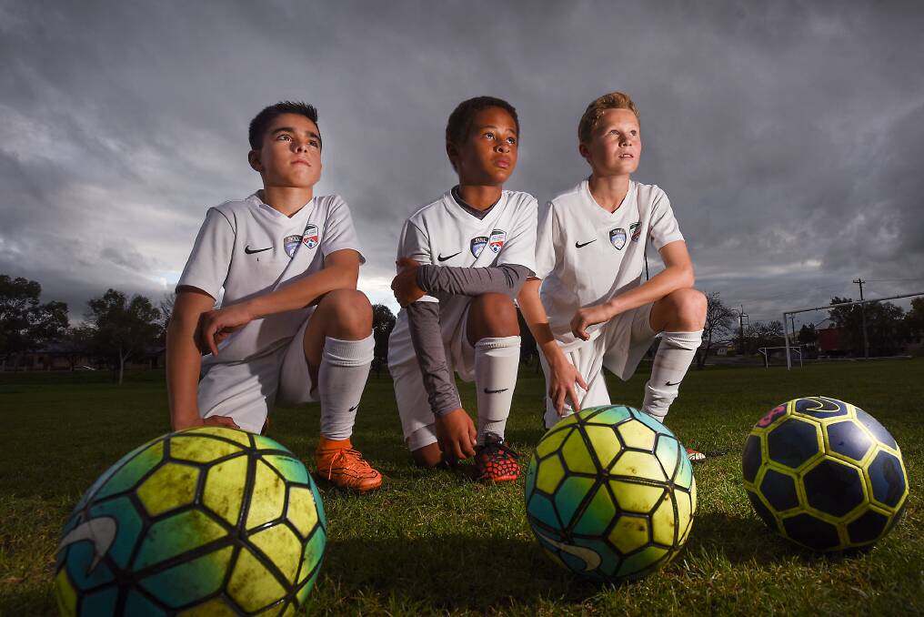 TAMWORTH STARS: From left: Beau Cavallaro, 12, Kilian Apen, 11 and Freddy Williams ,12, have scored Northern football rep honours after strong performances at a soccer camp at Speers Point.  Photo: Gareth Gardner 220716GGF02