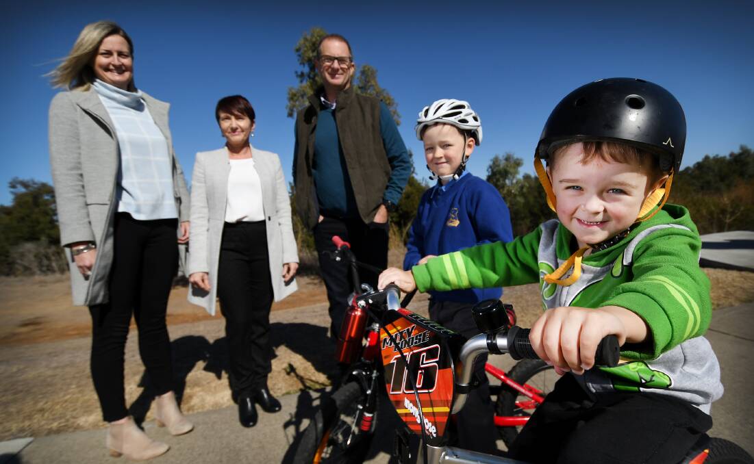 WHEELING GOOD: Front: Cooper Crowe, 4, and Noah Hayward, 6, with Airlie Horton, Anna Russell and Greg Johnstone at the Peel River path whcih has seen a spike in bike use. Photo: Gareth Gardner 300718GGA002