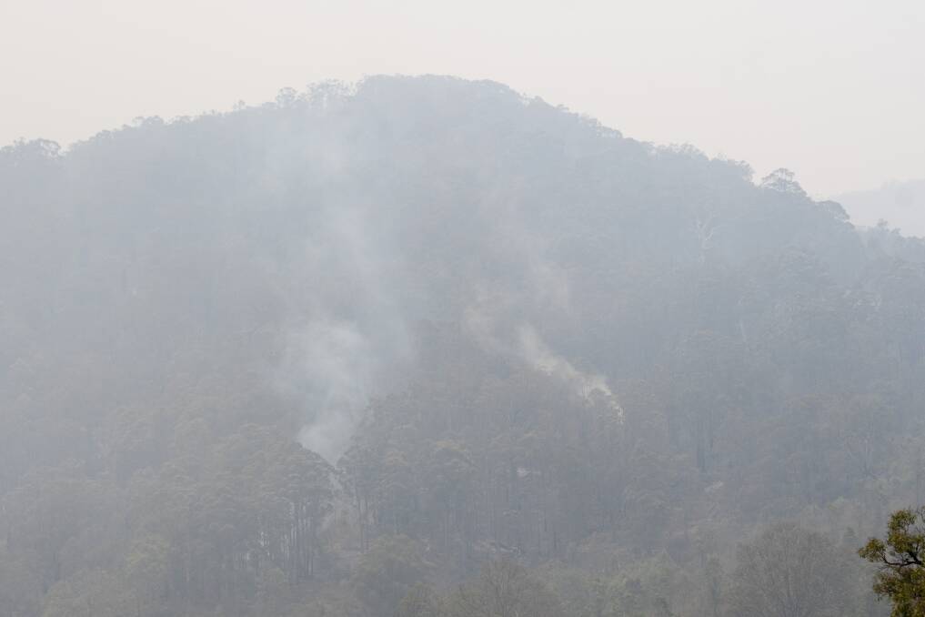 FIRES: Smoke in the hills near Dungowan Dam as fires smouldered around Dungowan Dam. Photo: Peter Hardin 221219PHB008

