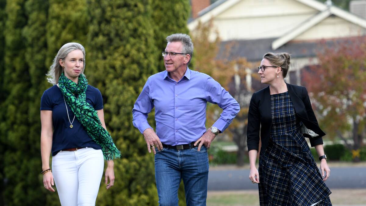 MORE SUPPORT: Evocities chair Kevin Mack, with Tamworth support staff Jessica Bradbery and Hannah Demnar, has called for more focus on regional NSW. Photo: Gareth Gardner 100518GGD002