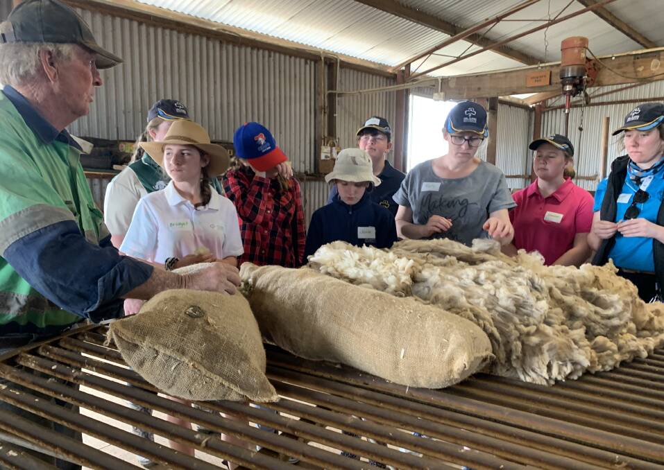 INSIGHT: Loomberah farmer Kevin Tongue talking to the visiting Girl Guides in the wool shed. Photo: Supplied