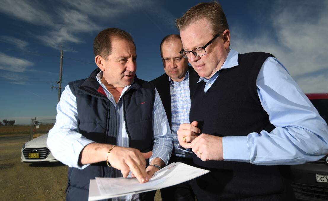 BUILDING UP: Developer Charles Sfeir, commercial real estate agent Gavin Knee and Tamworth Regional Council general manager Paul Bennett looking over the plans. Photo: Gareth Gardner 010719GGA03