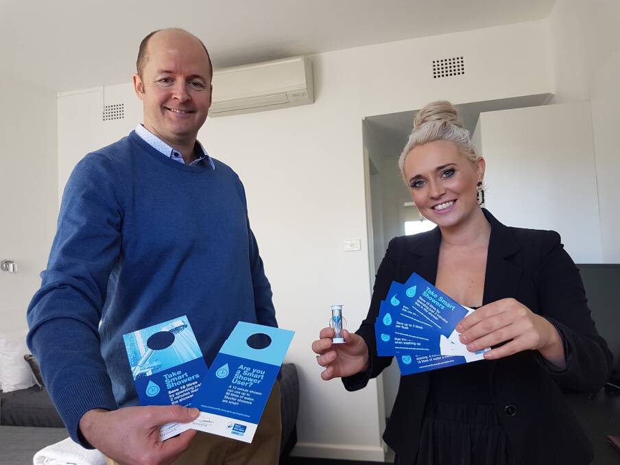 MESSAGE SPREAD: The council's water sustainability officer Ian Lobban with City Sider motel manager Aleyce Simmonds with some informations packs flowing into local accommodation providers. Photo: Jacob McArthur 070619JMA01