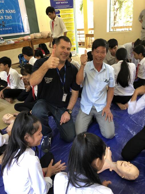 HELPING HAND: In the midst of a class. Photo: Supplied
