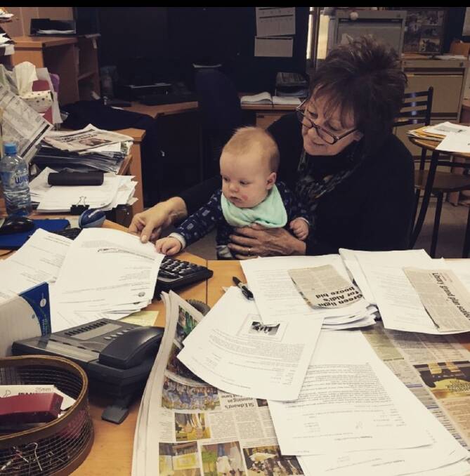 WRITE PATH: Former Northern Daily Leader editor Ann Newling shows grandson Nash the family trade.