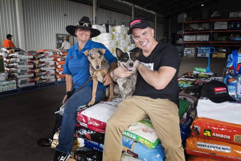 RELIEF: Sandy Herbert and with Trafalgar managing director Matt Cameron-Smith whose company donated dog food to Tamworth farmers. Photo: Peter Hardin 111218PHB021