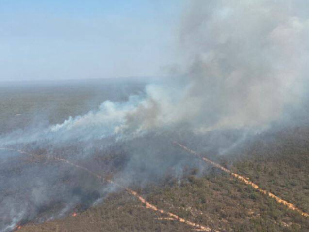 UPPER HAND: Favourable conditions have helped the RFS battle a blaze near Coonabarabran this weekend. Photos: NSW RFS