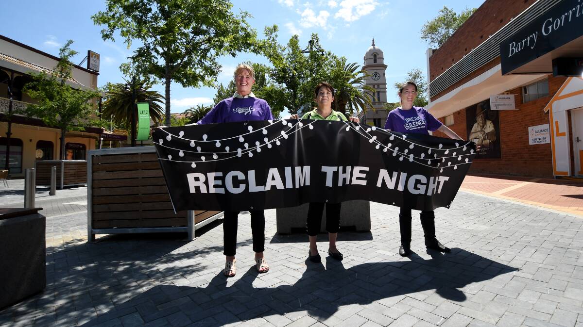 STAMPING IT OUT: From left: TFSS chief Belinda Kotris, domestic violence team leder Lynda Townsend and support worker Leigh Foord calling on people to join their march. Photo: Gareth Gardner 231018GGA02