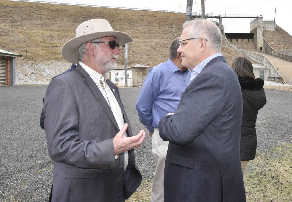 ON SITE: Tamworth councillor Russell Webb talks briefly with the Prime Minister Scott Morrison at Dungowan Dam on Sunday. Photo: Jacob McArthur