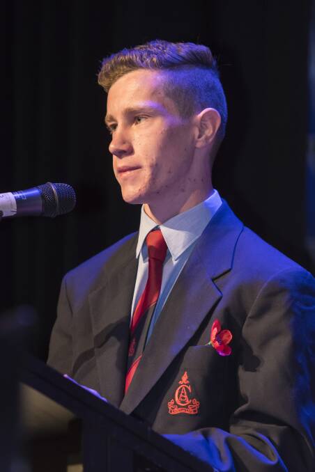 SOBERING: Calrossy student Thomas Burke gave the commemorative address at the 2017 Remembrance Day service. Photo: Peter Hardin 111117PHA082