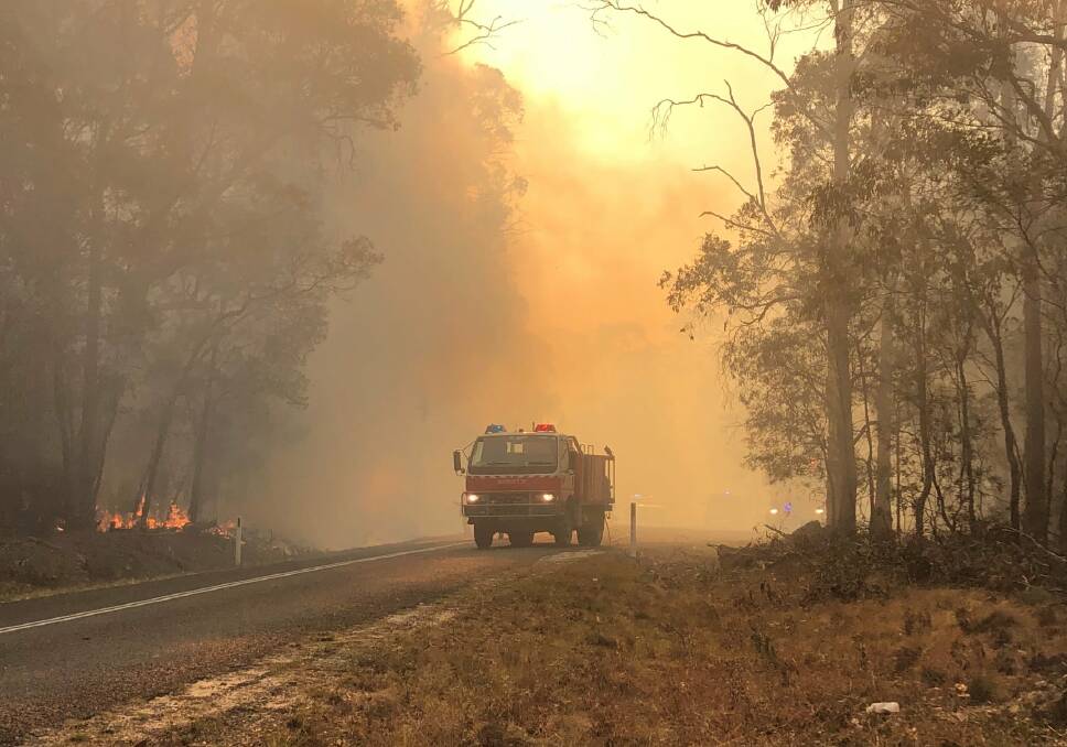 TRYING CONDITIONS: It has been a hectic weekend for New England firefighters battling big blazes across the region. Photo: New England RFS