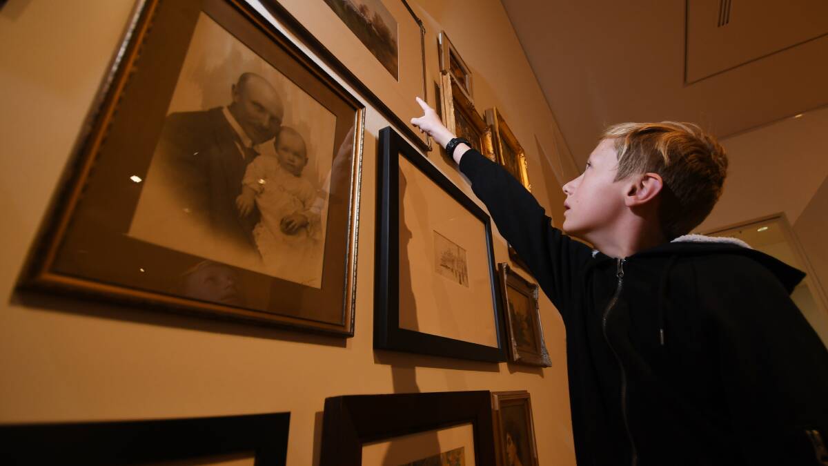 ART BEAT: A young enthusiast pores over some of the gallery's current displayed pieces in one of the biggest calendar years for visual art in Tamworth's history. Photo: Gareth Gardner 200619GGB04