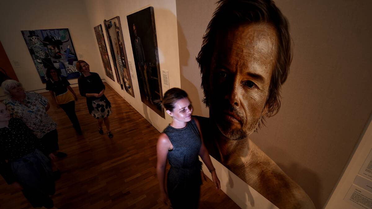 FACE TO FACE: Locals and travellers have been pouring into the Tamworth art gallery to catch a glimpse of the Archibald Prize. Photo: Gareth Gardner 150119GGC01