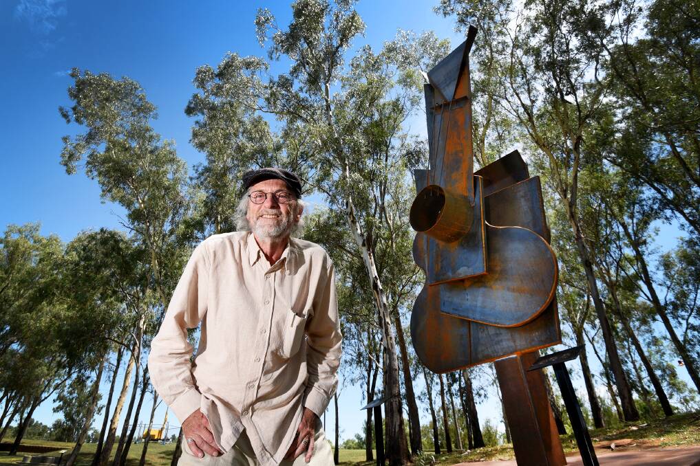 ON THE MAP: Local artist Peter Hooper with Tamworth's second big guitar which is set to be officially launched during the country music festival. Photo: Gareth Gardner 190117GGC03