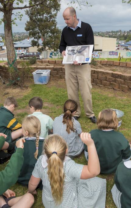 BE PREPARED: Council water sustainability officer Ian Lobban spoke to kids at St Nicholas School about conservative water use. Photo: Peter Hardin 171016PHA012