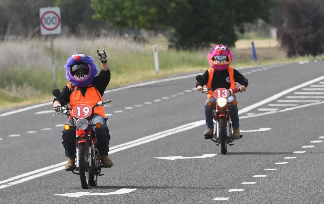 GAME FACE: A couple of Variety Postie Dash riders give a colourful send-off to Tamworth, setting off on a six-day trek around the region. Photo: Gareth Gardner 041118GGA09