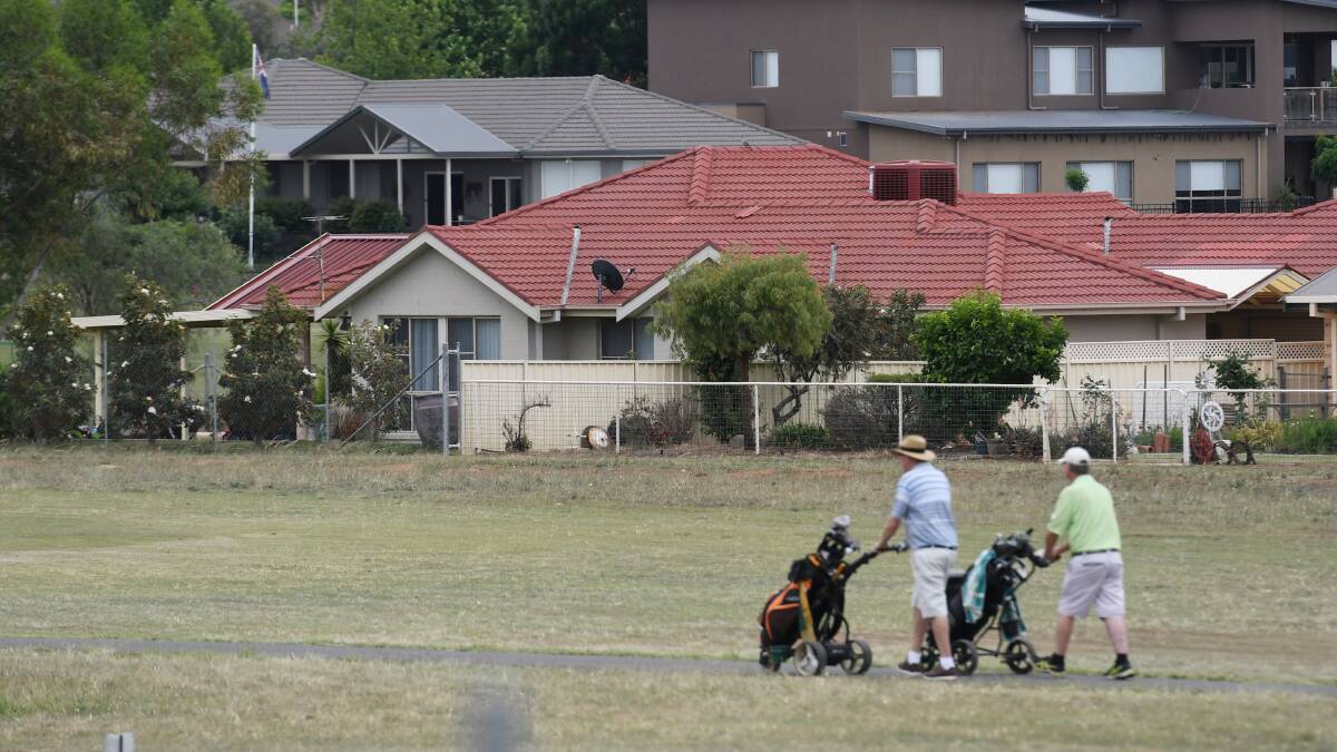 TEED UP: Golfers having a casual hit at the Longyard Golf Course this week as the owner lodges an appeal over a refused DA. Photo: Gareth Gardner 141118GGB04