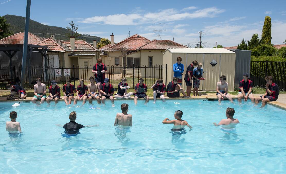 SPEED RACERS: The students took their Swimming Spheros designs to the pool in a test to find the best speed across the water. Photo: Peter Hardin 291116PHB081