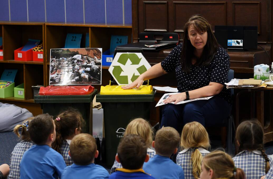 TALKING TRASH: Council waste sustainability officer Angela Dodson regularly takes her recycling lessons into schools. Photo: Gareth Gardner 141117GGC007