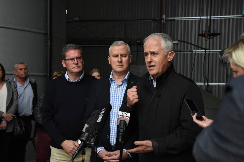 CASH SPLASH: Form left: local government minister John McVeigh, deputy PM Michael McCormack and prime minister Malcolm Turnbull announced drought funding for councils in Forbes on the weekend. Photo: Renee Powell