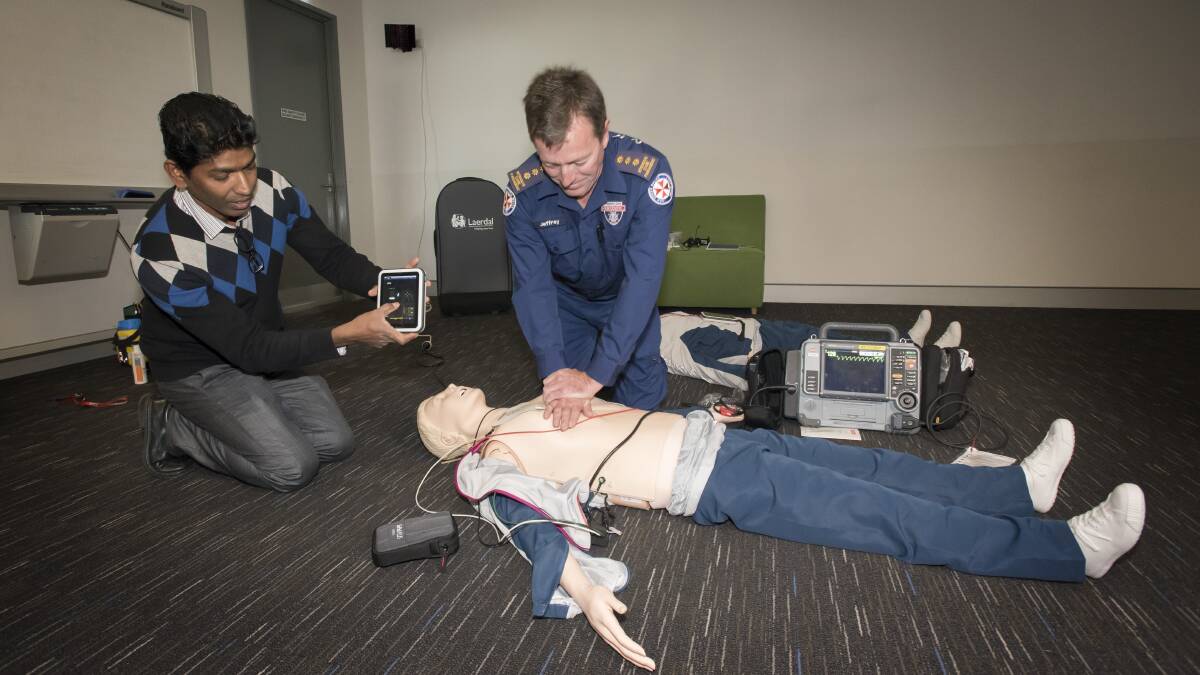 PUMP IT UP: NSW paramedic educator Jeffrey Purse tests out his CPR skills on one of the high-tech mannequins donated to the region. Photo: Peter Hardin 280819PHC033