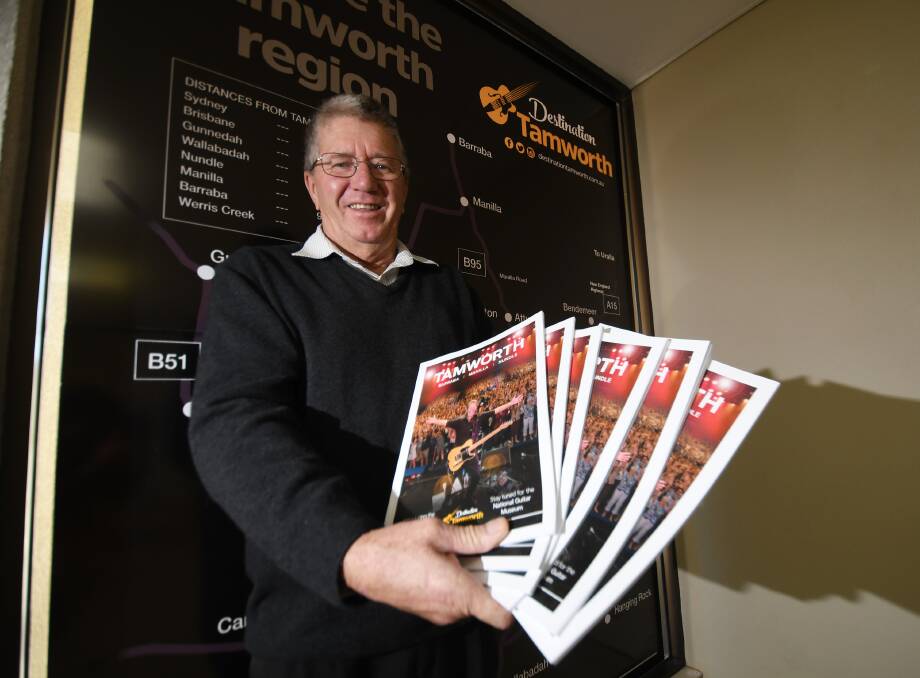 TELL YOUR FRIENDS: Tamworth mayor Col Murray with the region's new visitor guide urging people to tell their mates to visit the area. Photo: Gareth Gardner 270619GGB05