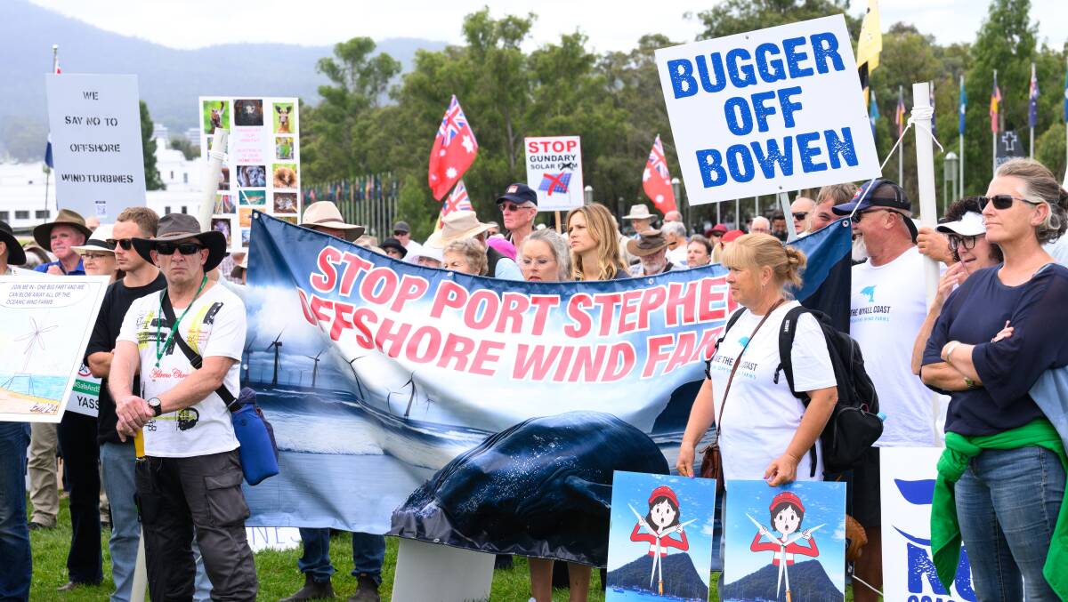 A large group gathered on the Parliament House lawn to protest renewable energy developments. Picture by Sittihixay Ditthavong
