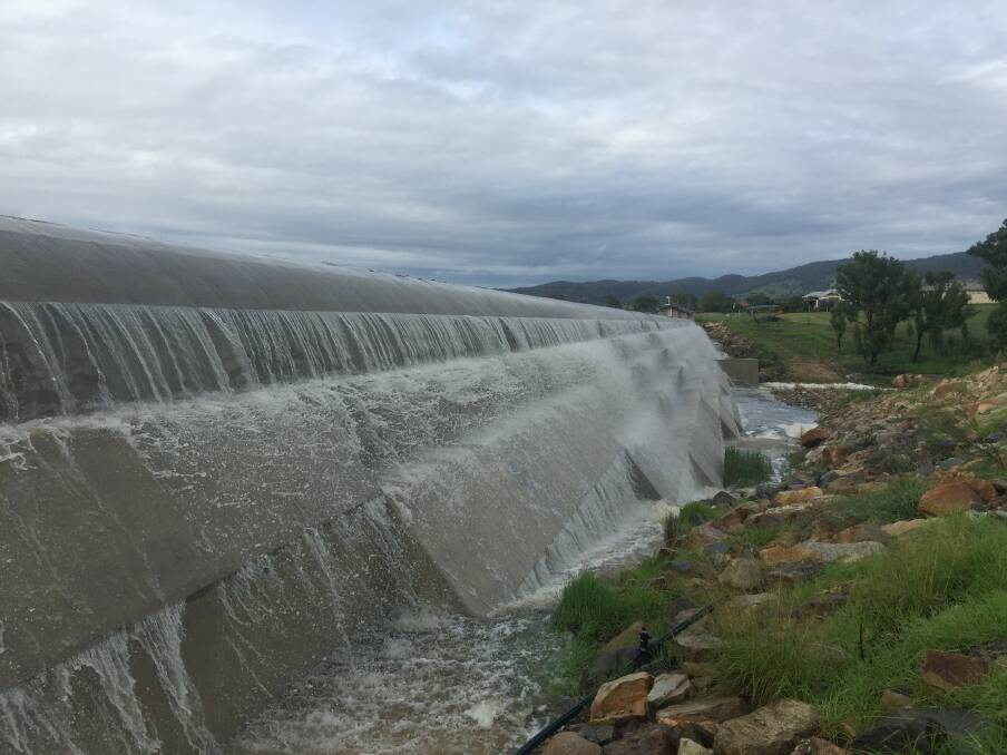 OVERFLOWING: Cascades of water poured over the Tenterfield dam this week which was a welcome sight for the community. Photo: Tenterfield Shire Council