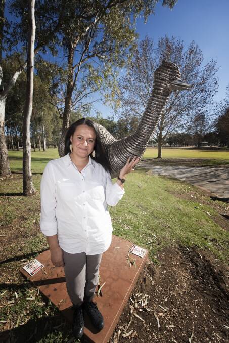 GET PEOPLE THINKING: Gomeroi artist and weaver Amy Hammond with her sculpture which has a very poignant message. Photo: Peter Hardin 030719PHB019