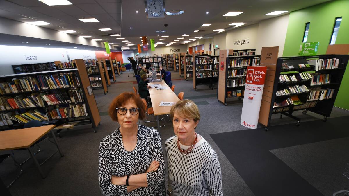 BAD BOOKS: Library manage Kay Delahunt and councillor Juanita Wilson call for increased government funding. Photo: Gareth Gardner 130818GGB03