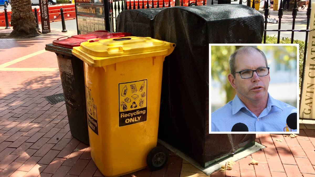 COVER UP: Council has covered up its $112,000 bins in favour of the old wheely-bin, Bruce Logan explains why. Photo: Jacob McArthur, inset Gareth Gardner