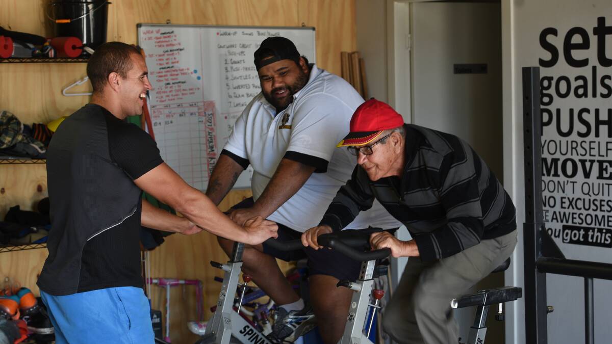PEDAL POWER: Bart Sampson and Cyril Sampson go head-to-head in Soul Fit HQ in West Tamworth. Photo: Gareth Gardner 140617GGC06