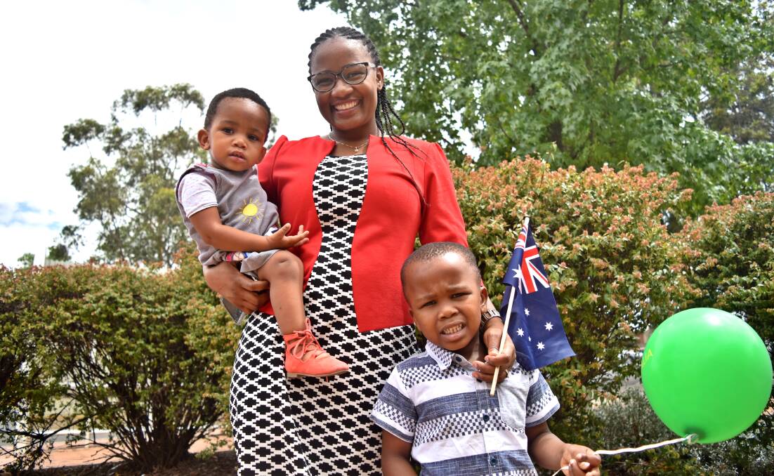 NEW HOME: One of Tamworth's 10 newest Australians Naledi Mosarwa with children Bella and Zac. Photo: Ben Jaffrey 260118BJ01