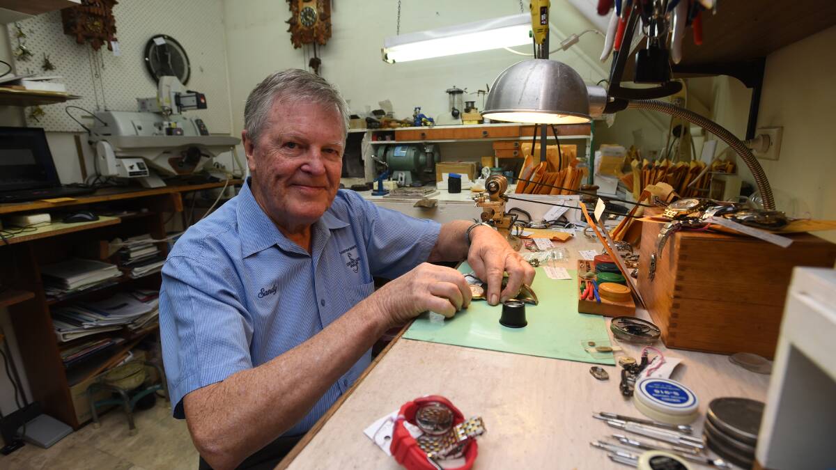 TIME TO TIME: Watchmaker and jeweller Sandy McKinnon has kept Tamworth on time for 55 years. Photo: Gareth Gardner 010416GGC06
