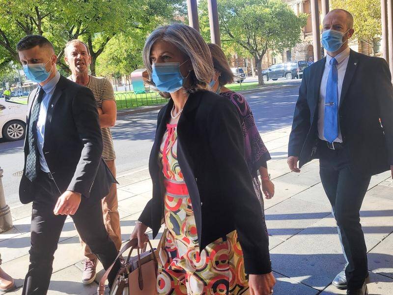 Chief Health Officer Nicola Spurrier (centre) was verbally abused outside an Adelaide court.