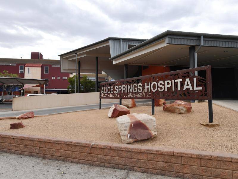 An Alice Springs woman who recently returned from the UK has tested positive for COVID-19.