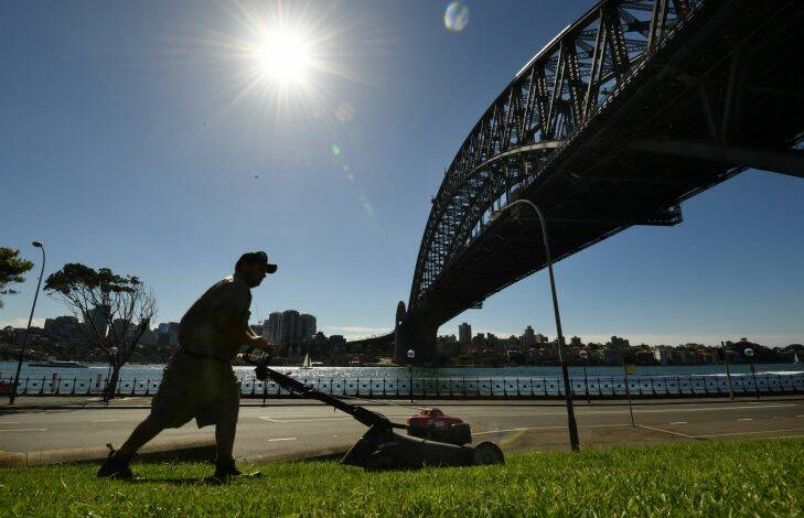 Cooler weather today, Chris Mclachlan, Property NSW mowing under the Sydney Harbour Bridge 27th April 2017 Photo by Louise Kennerley smh