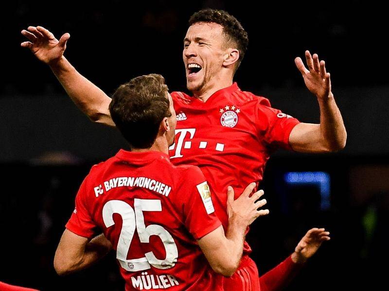 Bayern Munich's Ivan Perisic (R) and Thomas Mueller have both scored in a 4-0 over Hertha Berlin.