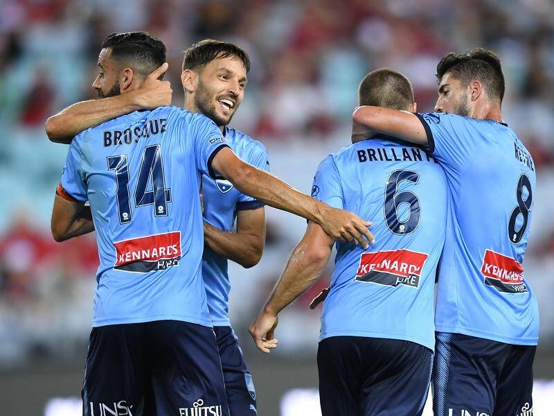 Alex Brosque has scored in Sydney FC's storm-delayed 3-1 A-League win over Western Sydney.