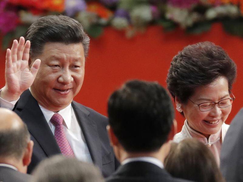President Xi (l) will return to Hong Kong, where he marked the appointment of Carrie Lam (r) in 2017