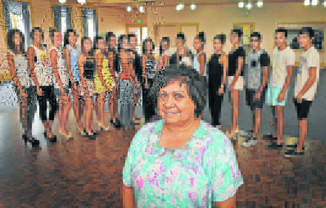 STRIKE A POSE: Colleen Tighe Johnson, front, with her models and some of her assistants ahead of a special Aboriginal showcase fashion parade this weekend. Pictured are, from left, Sharnae Smith, Keely-Che Cain, Paris Knox, Shonnalea Smith, Jayden Hunt, Bianca Berry, Kiarra Dixon, Janaya Lamb, Shontaia Berry, Melanie Lamb, Annie Duke, Kim Knox, Tanielle Cutmore, Alina Swan, Samantha Duncan, Tamika Darcy, Karwin Knox, Isaiah Spearim and Alaijah Berry. Photo: Geoff O Neill 050115GOC01