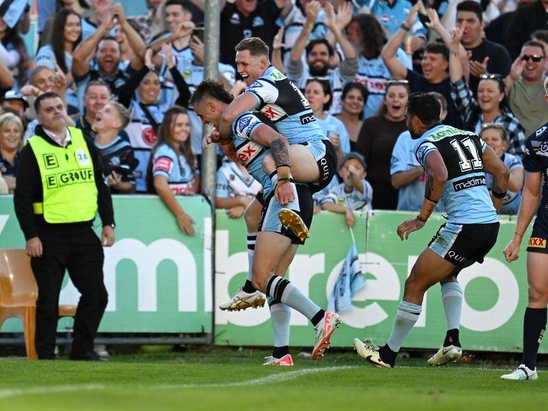 Debutant Samuel Stonestreet (R) was one of five try-scorers in Cronulla's thrashing of the Cowboys. (HANDOUT/NRL PHOTOS)