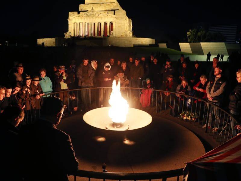 Crowds around the perpetual flame at the Shrine of Remembrance in Melbourne.