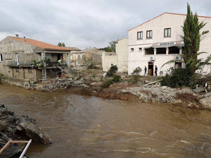 Flash floods have washed away villages and cars in southern France and killed at least 12 people.