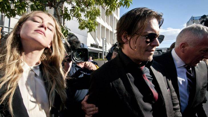 Relieved actor Johnny Depp and his actress wife Amber Heard leave Southport Court after a magistrate imposed a one month good behaviour bond on Ms Heard without conviction. Photo: Robert Shakespeare
