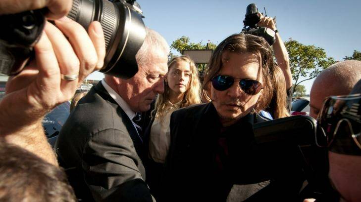 18.4.2016 . Getty. Fairfax. Amber Heard with her husbane, actor Johnny Depp, work their way through a media scrum outside Southport Court. Photo: Robert Shakespeare