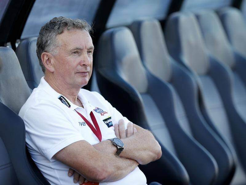 Coach Ernie Merrick isn't thinking about the A-League title after Newcastle secured a finals spot.